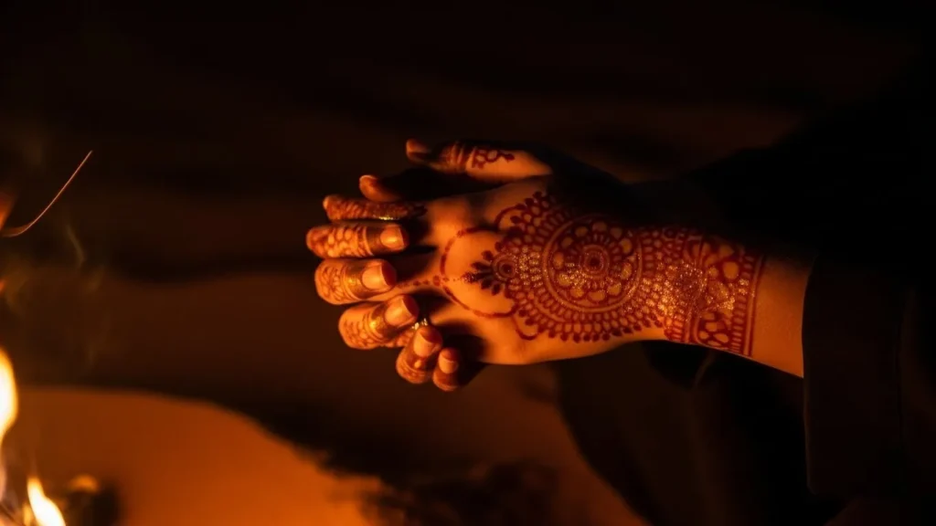 Henna art glowing softly in warm campfire light at night desert safari